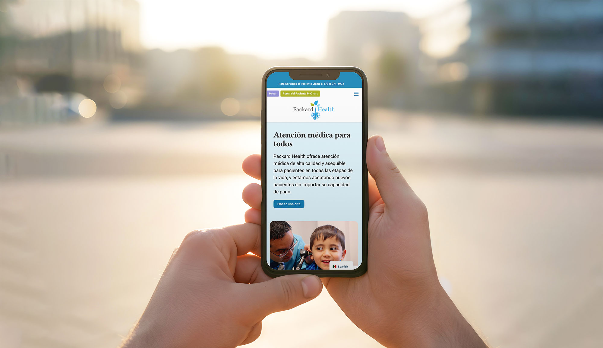 Packard Health website on mobile device in hand